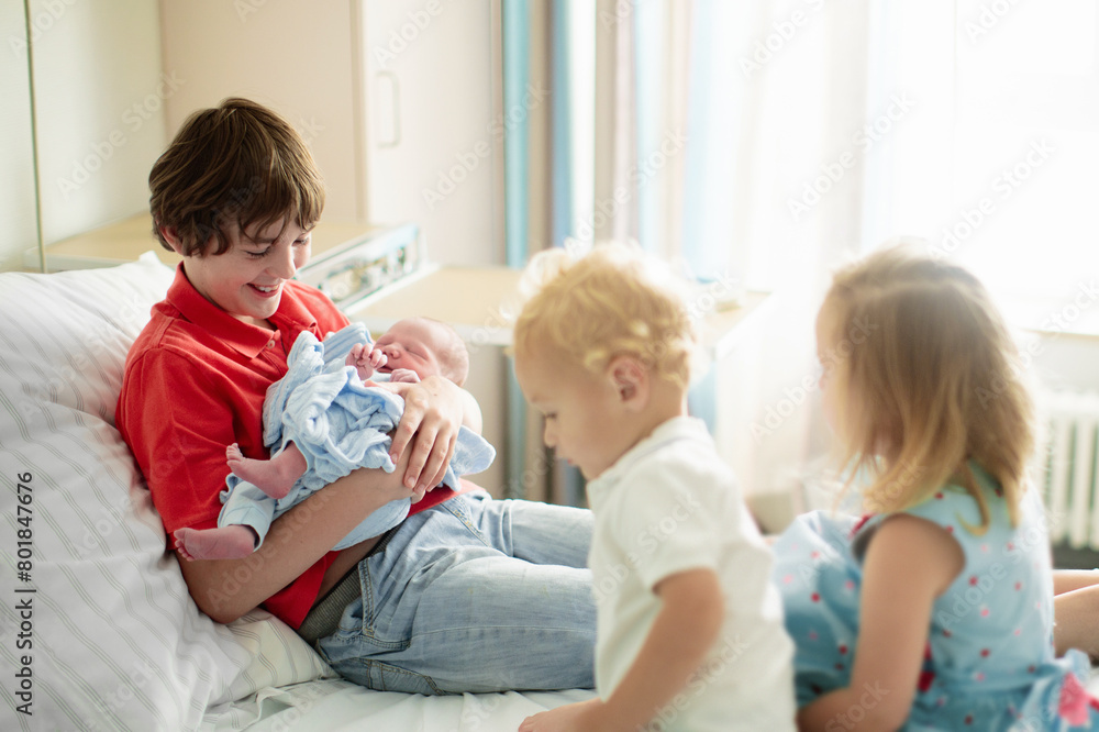 Siblings meet newborn baby in hospital Siblings meet newborn baby in hospital