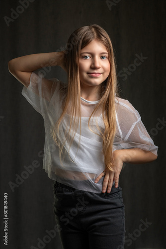Studio portrait of a young beautiful long-haired girl.