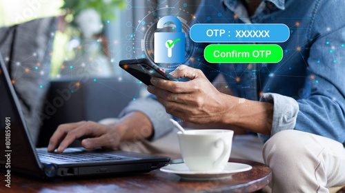 Information One Time Password (OTP) on smartphone to confirm account mobile banking application, internet banking, payment online shopping during man using smartphone and laptop