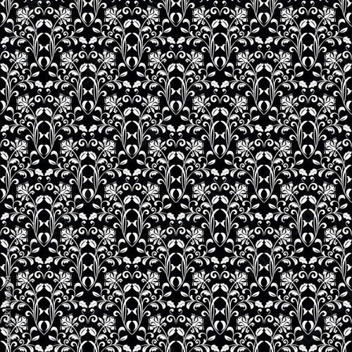 Wallpaper in the style of Baroque. Seamless vector background. White and black floral ornament. Graphic pattern for fabric, wallpaper, packaging. Ornate Damask flower ornament.