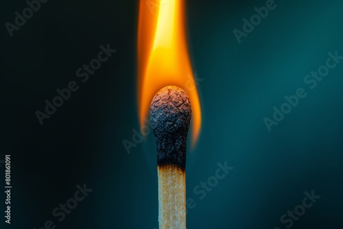 Illuminated matchstick with a dynamic flame against a dark background. Perfect for concepts about ideas and ignition.