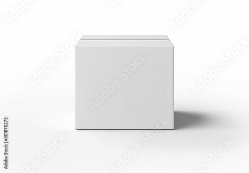 A white square packaging cardboard box stands prominently on a clean white background, perfect for showcasing branding and product designs © Lars