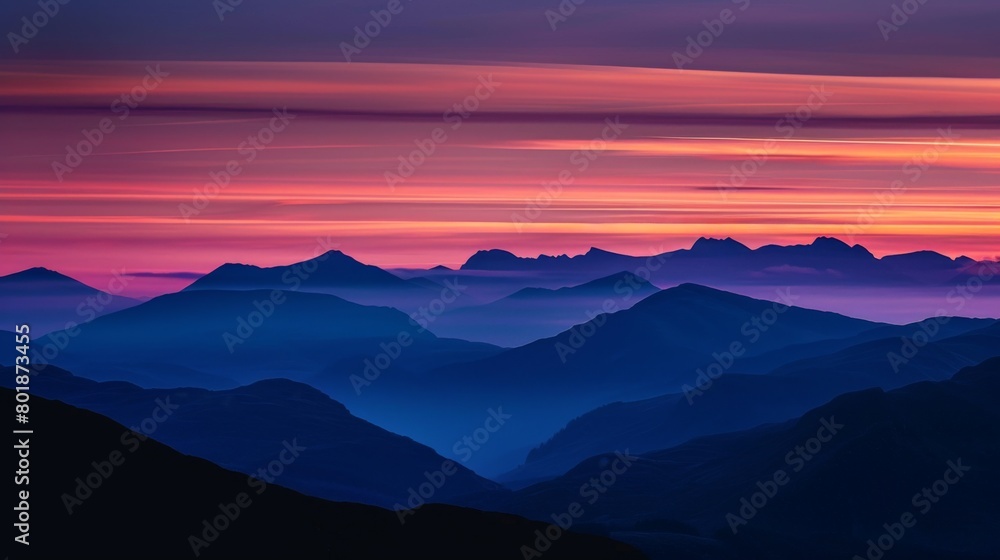 A majestic mountain range silhouetted against a darkening sky, with streaks of orange and purple painting the horizon. A majestic mountain range silhouetted against a darkening sky, with streaks of orange and purple painting the horizon.