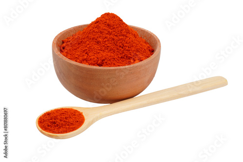 Red chili powder in both a wooden bowl and a wooden spoon Isolated Transparent