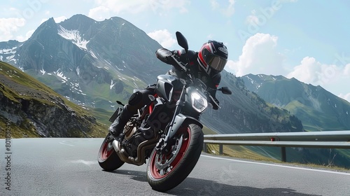 A realistic picture of a motorcyclist on a mountain road with black and red details that faces the camera photo