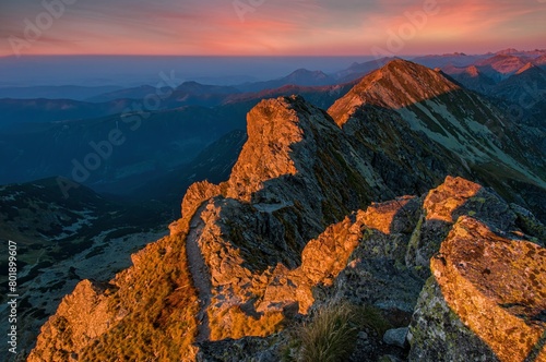 Beautiful colorful sunset on top of the hill. Hiking in Slovakia mountains Banikov and Ziarska valley  Western Tatras Slovakia. Beautiful mountain places of Europe