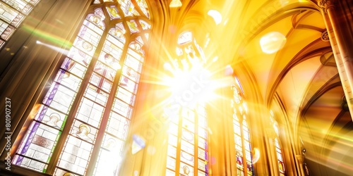 Radiant sunlight streaming through colorful stained glass windows in a cathedral, creating a vibrant and spiritual atmosphere. photo
