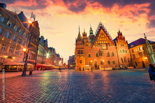 Dramatic summer sunset in Wroclaw Market Square with Town Hall. Picturesque evening view of historical capital of Silesia, Poland, Europe. Travel the world..