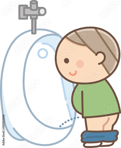 小便器で用を足す男の子