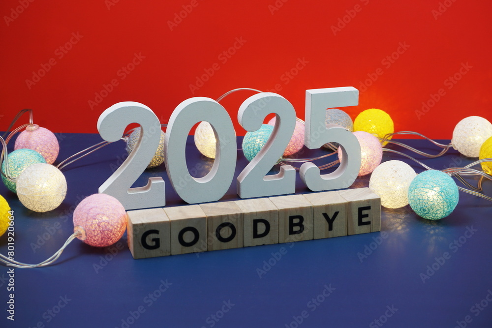 Goodbye 2025 word alphabet letters on red and blue background Stock