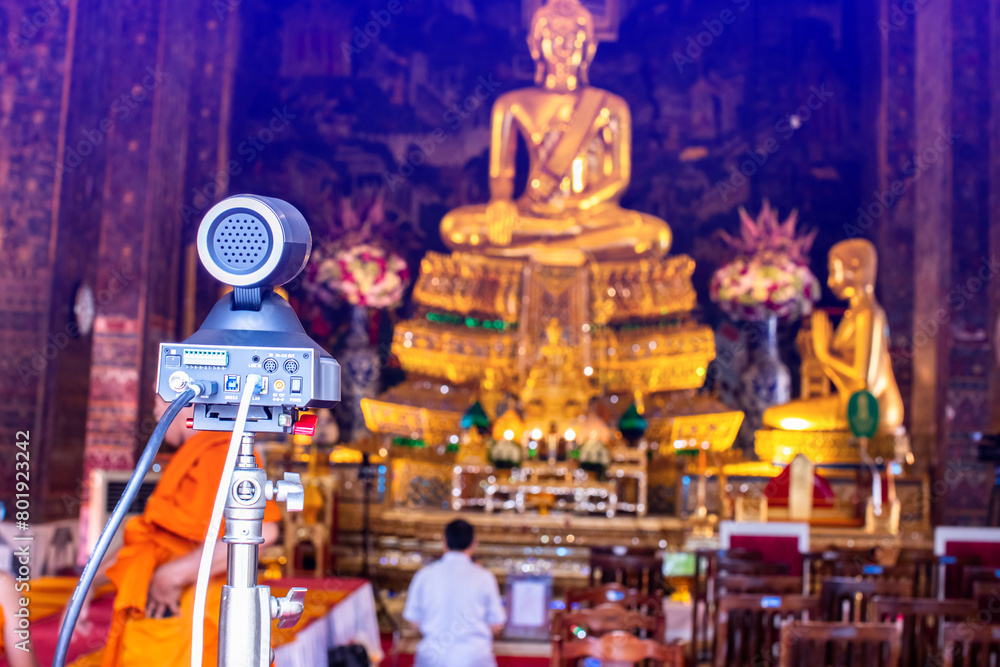 Selective focus to cameras and video transmission equipment for live Internet broadcasting at temples in Thailand.