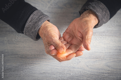Caucasian elderly woman suffering from finger pain. © andranik123