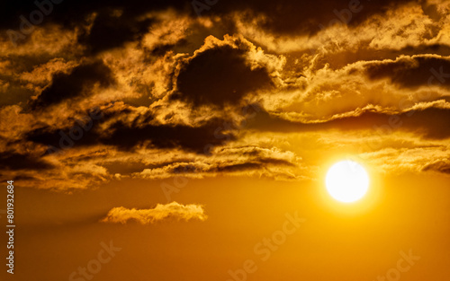 An impressive cloudy sundown orange sky. Space for your text and logo.