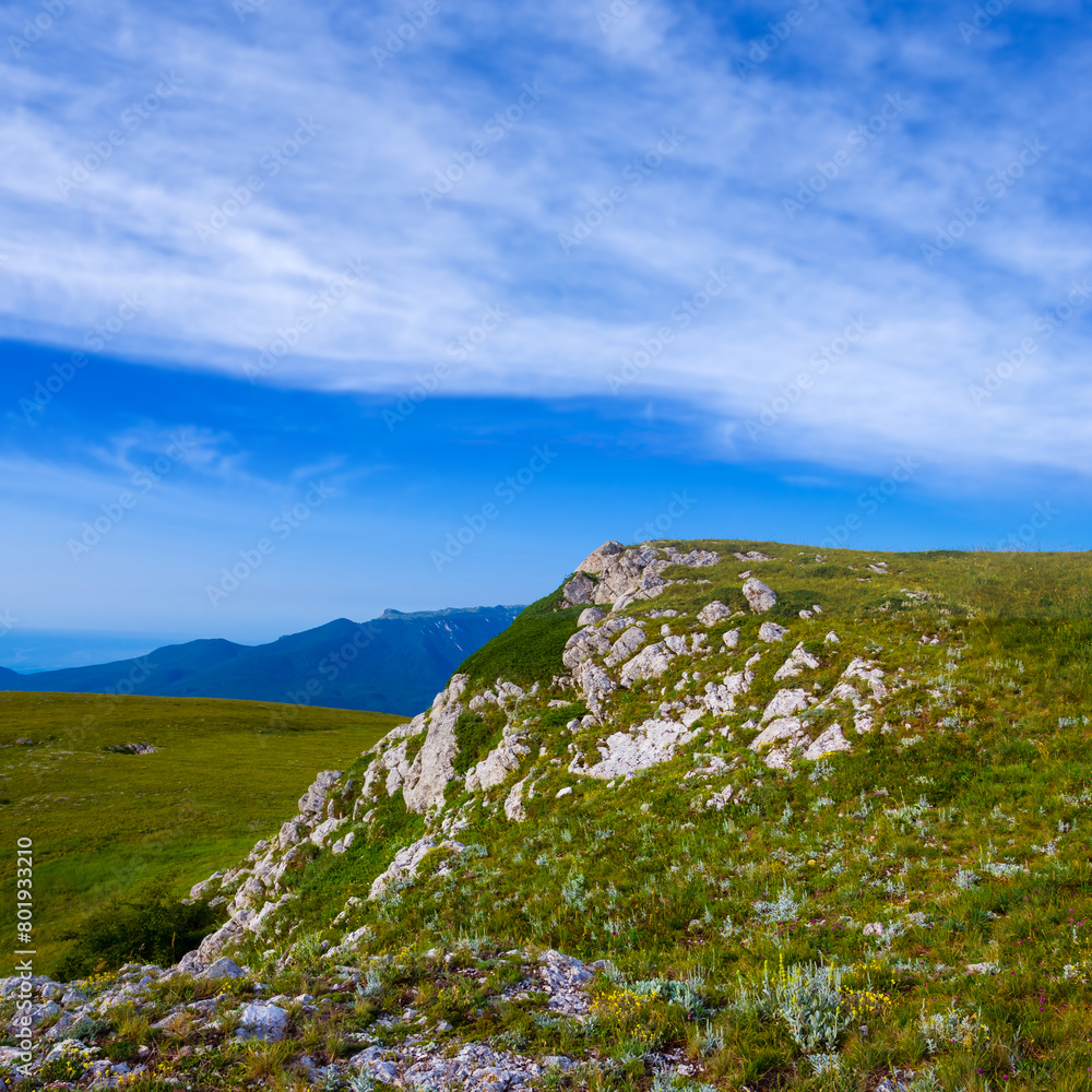 green mountain valley under a blue cloudy sky green mountain valley under a blue cloudy sky