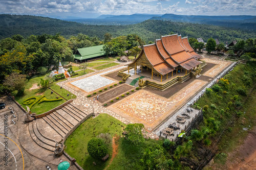 The aerial top view of Wat Sirindhorn Wararam or Wat Phu Prao, also known as the Glow Temple, is located in Sirindhorn, Ubon Ratchathani photo