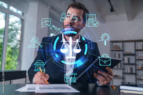 Considered businessman in formal wear signing contract holding tablet device at office room with papers. Concept of successful business deal, agreement, partnership, documents. Legal and law icons.