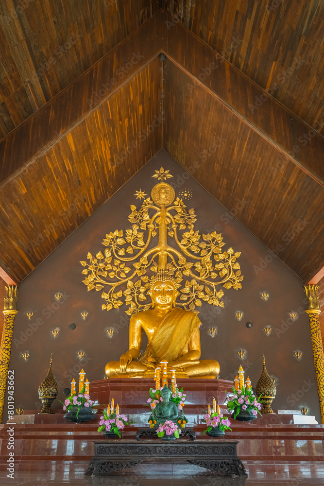 The gold Buddha in the Wat Sirindhorn Wararam or Wat Phu Prao, also known as the Glow Temple, is located in Sirindhorn, Ubon Ratchathani, Thailand