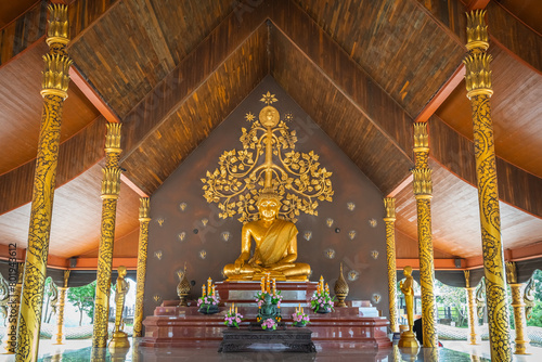 The gold Buddha in the Wat Sirindhorn Wararam or Wat Phu Prao, also known as the Glow Temple, is located in Sirindhorn, Ubon Ratchathani, Thailand