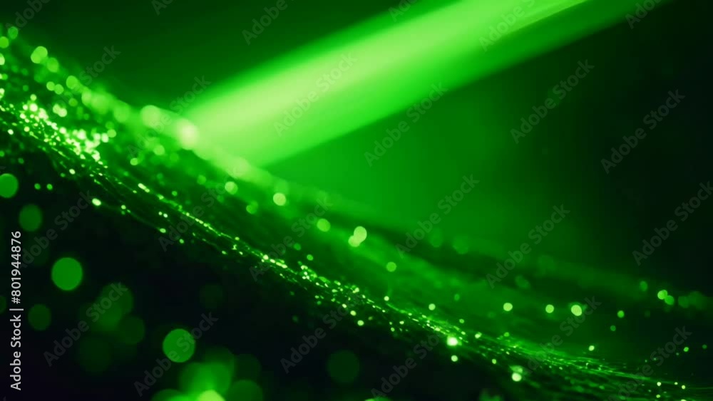 Abstract looped colorful background with bright neon blue green gold purple particles