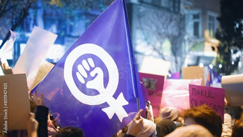 Feminist protester walk night wave flag. 8 march feminism protest symbol. Many demonstration banners. Woman riot anti violence. Female rights picket. Girl power fight. People rebels hold strike sign. photo
