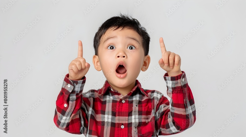 Excited Asian Child Pointing Upwards with Surprised Expression Excited Asian Child Pointing Upwards with Surprised Expression