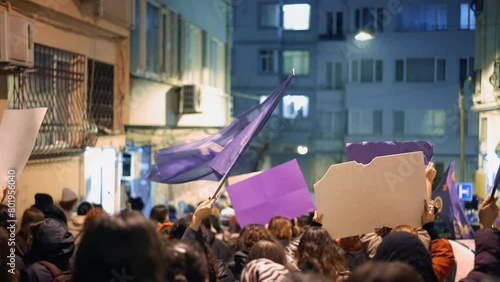 Feminist protesters walk city night. 8 march day feminism protest. Many demonstration banners. Woman riot anti violence. Female rights picket. Girl power fight. People rebels hold carry strike placard photo