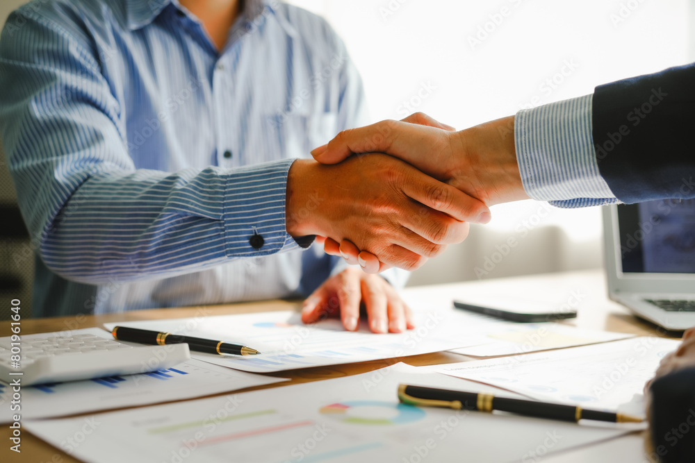 Businessman conducts financial discussions, sealing deals with handshakes. Expert in accounts, loans, mortgages, interest rates, credit scores, savings, checking, stocks, bonds, mutual funds Businessman conducts financial discussions, sealing deals with handshakes. Expert in accounts, loans, mortgages, interest rates, credit scores, savings, checking, stocks, bonds, mutual funds
