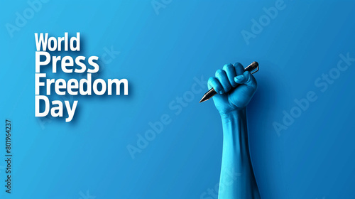 Word press freedom day concept with raised fist holding  pen isolated on blue background  photo