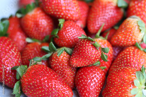 Red ripe strawberries background. Strawberry texture close up photo. Fresh organic berries macro. Eating fresh concept. 