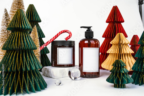 dark jar with lid and dispenser on the background of Christmas decorations, side view