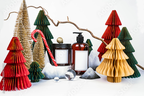 dark jar with lid and dispenser on the background of Christmas decorations, side view