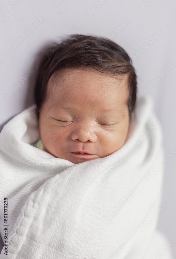 Closeup portrait of asian happy new born baby sleeping sweet dream on bed over white background with copy space. Healthy newborn child take a nap asleep Family love newborn healthcare medical concept Closeup portrait of asian happy new born baby sleeping sweet dream on bed over white background with copy space. Healthy newborn child take a nap asleep Family love newborn healthcare medical concept