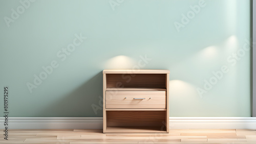 A wooden nightstand with a drawer sits in front of a white wall © Jati