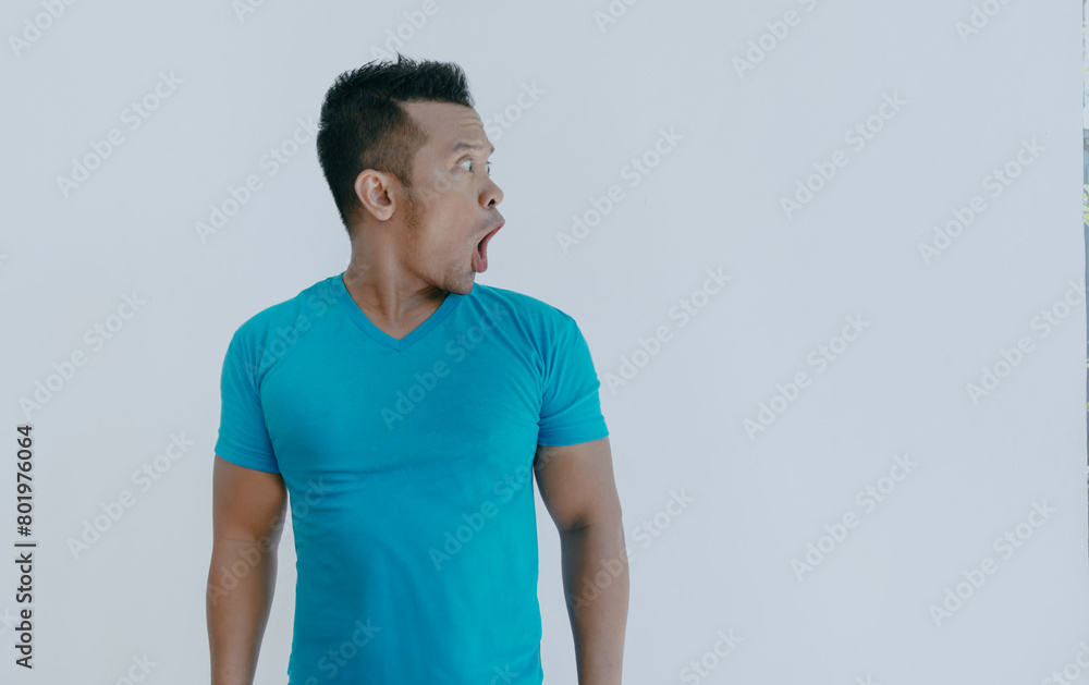 Wow and shocked face of funny Asian man isolated on white background. Wow and shocked face of funny Asian man isolated on white background.