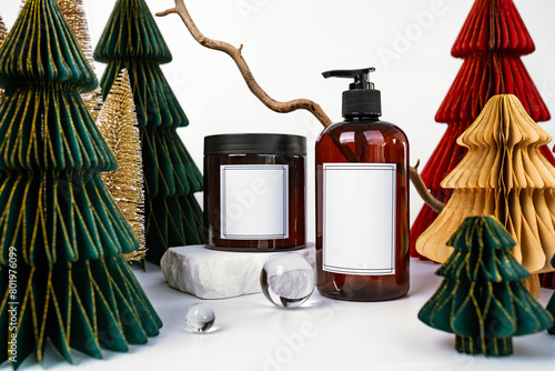 dark jar with lid and dispenser on the background of Christmas decorations, side view
