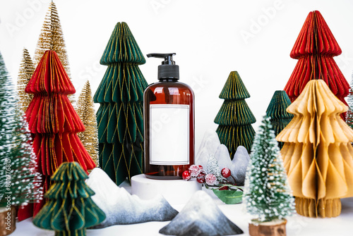dark jar with dispenser on the background of Christmas decorations, side view