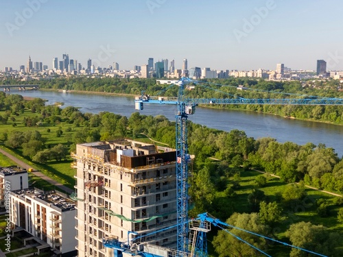 Construction site  of a new housing estate in green areas, left-bank Warsaw, Poland.