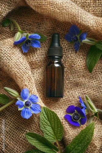 essential oil cosmetics on burlap background
