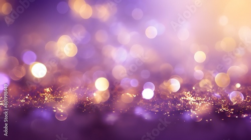 Bokeh-style abstract Christmas background in shades of violet and gold. Golden particles on a holiday bright purple blurred background