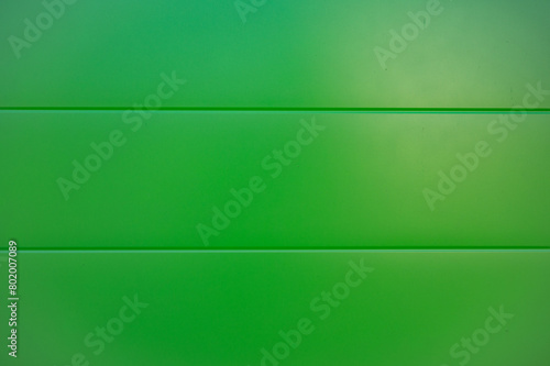 Green flat background of plastic planks.