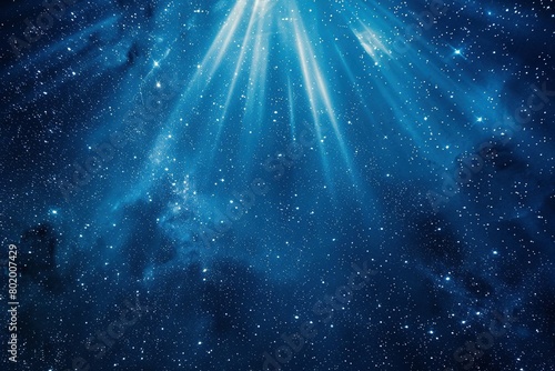 Deep indigo backdrop illuminated by a burst of starlight, sending rays of light outward.