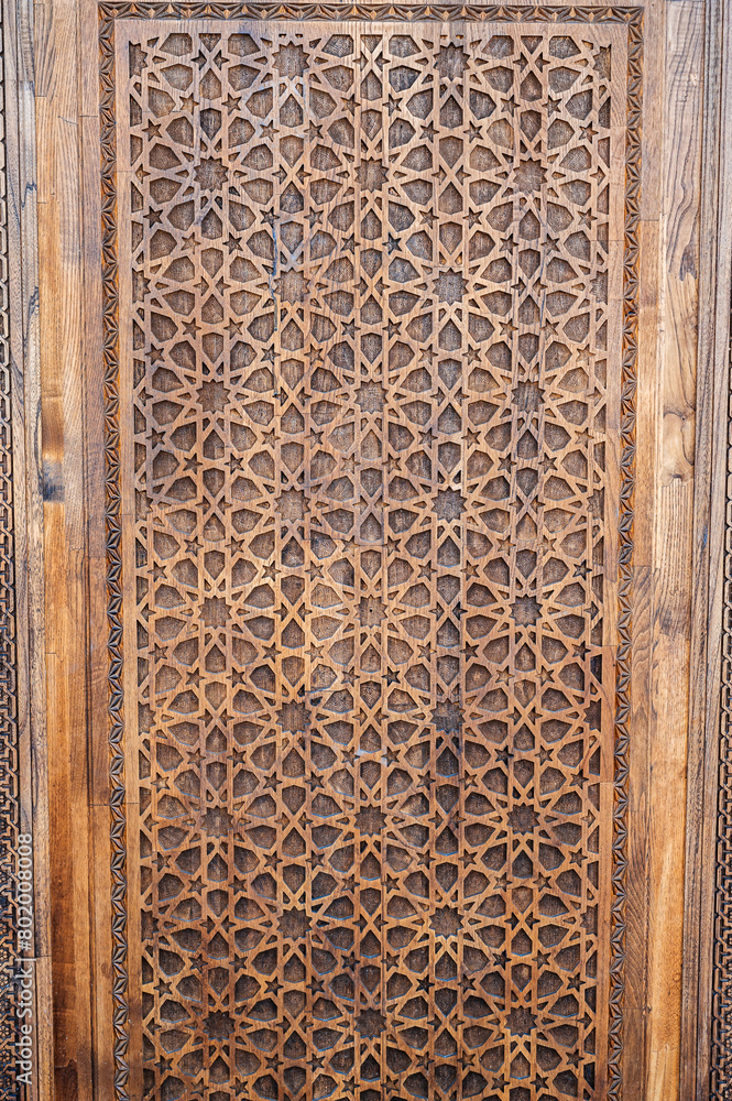 arabic Uzbek Islamic patterns ornament with stars on a modern wooden carved door in Uzbekistan in Tashkent