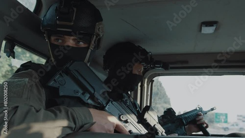 Special forces being transported in a car