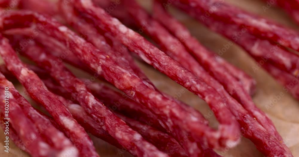 Thin dehydrated meat close-up, dry pork meat on the table Thin dehydrated meat close-up, dry pork meat on the table
