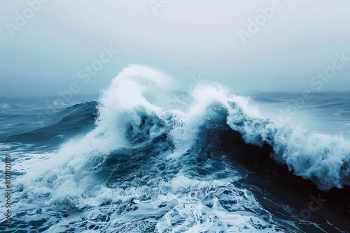 A large wave crashing into the ocean, with the water splashing