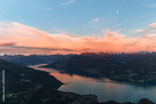 The lights and colors of the sunset on Lake Como, near the town of Tremezzo, Italy - December 24, 2023
