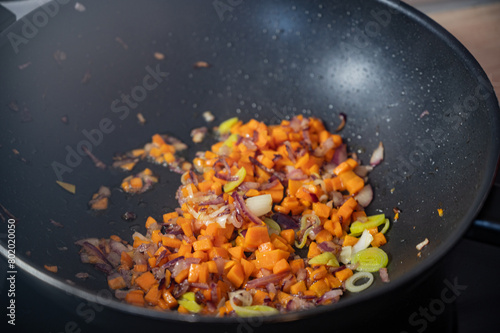 wok pan with finely chopped vegetables