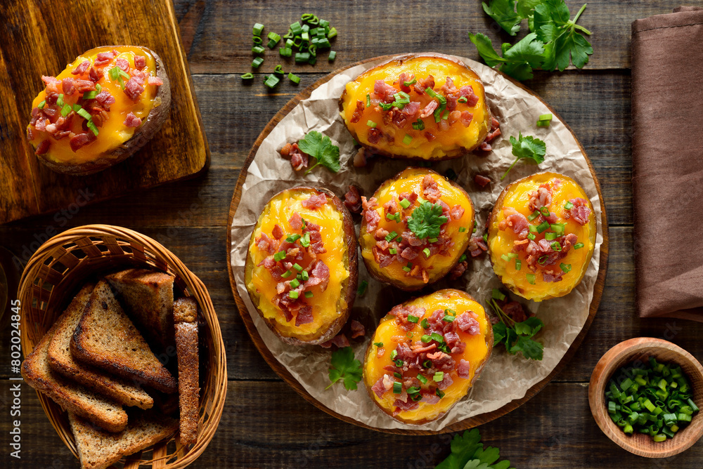 Baked stuffed potatoes with bacon, green onion and cheddar cheese Baked stuffed potatoes with bacon, green onion and cheddar cheese