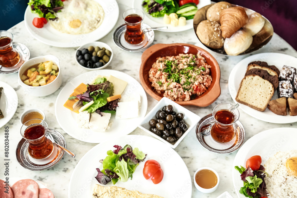 Abundant Table Laden With Various Plates of Food Abundant Table Laden With Various Plates of Food