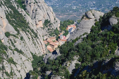 View of Santa Maria de Montserrat Abbey and the surrounding mountains. Montserrat Monastery, Barcelona, Spain. 